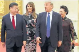  ?? REUTERS ?? US President Donald Trump and his Melania arrive for a state dinner with Chinese President Xi Jinping and his Peng Liyuan at the Great Hall of the People in Beijing on Thursday.