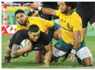  ??  ?? New Zealand All Blacks player Sonny Bill Williams dives to score a try as Australian Wallabies players Curtis Rona and Henry Speight try to tackle him. (Reuters)
