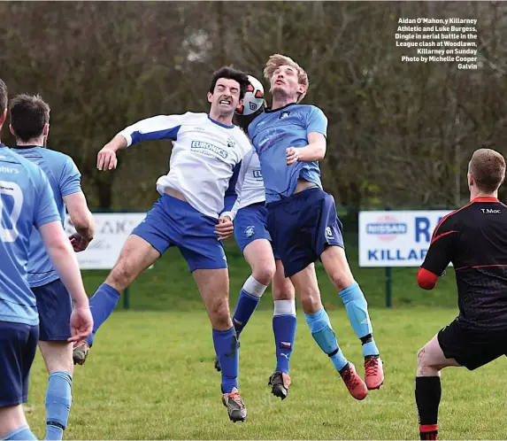  ??  ?? Aidan O’Mahon,y Killarney Athletic and Luke Burgess, Dingle in aerial battle in the League clash at Woodlawn, Killarney on Sunday Photo by Michelle Cooper Galvin