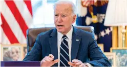  ?? The Associated Press ?? President Joe Biden speaks before signing the American Rescue Plan, a coronaviru­s relief package, in the Oval Office of the White House on Thursday in Washington.