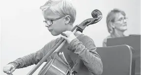  ?? FRANCIS GARDLER/LINCOLN JOURNAL STAR VIA AP ?? Carter Frey plays his cello.