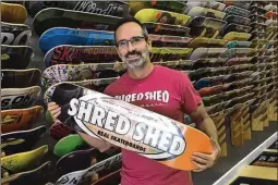  ?? KEVIN D. THOMPSON / THE PALM BEACH POST ?? Joe Varricchio, owner of Shred Shed in downtown Lake Worth, believes Lake Avenue has the potential to be Palm Beach County’s next great street. Shred Shed has been in business for 19 years, in three locations.