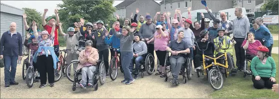  ?? (Pic: EOB-d) ?? THREE CHEERS FOR BIKE WEEK! Service users and staff from Cope Foundation and St Joseph’s at the ‘Come and try a bike’ event at Coláiste an Chraoibhín in Fermoy on Wednesday.