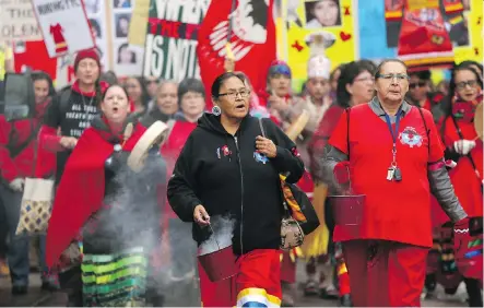  ?? PHOTOS: LEAH HENNEL ?? The Sisters In Spirit Vigil in Calgary on Thursday was one of 200 similar vigils occurring across Canada and internatio­nally.