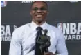  ?? PHOTO BY EVAN AGOSTINI — INVISION — AP ?? Kia NBA Most Valuable Player, Best Style & Game Winner Award winner, Russell Westbrook, poses in the press room at the 2017 NBA Awards at Basketball City at Pier 36 on Monday in New York.