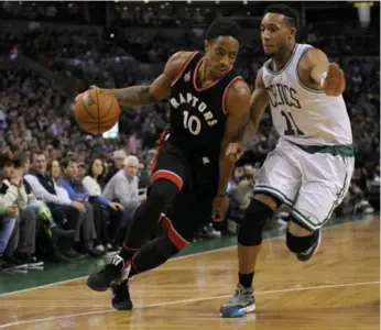  ?? BOB DECHIARA/USA TODAY SPORTS ?? The Raptors’ DeMar DeRozan drives past Boston’s Evan Turner during first-half action Wednesday at TD Garden.