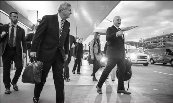  ?? ?? Landrieu, right, speaks with U.S. Secretary of Agricultur­e Tom Vilsack after arriving Oct. 27 in Raleigh, N.C. Before the midterm elections, Landrieu had traveled to 37 cities and spoken to every governor except Ron Desantis of Florida and Greg Abbott of Texas.