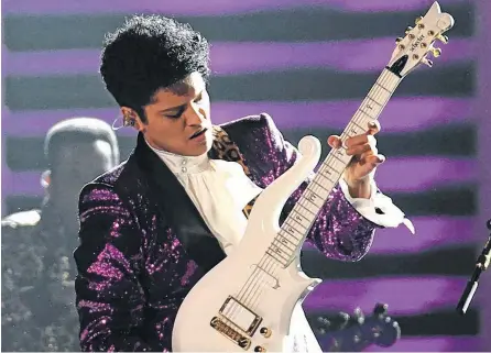  ??  ?? Bruno Mars es un talento de la música afroameric­ana.