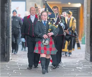  ??  ?? The parade arrives in St Salvator’s Quad on North Street.