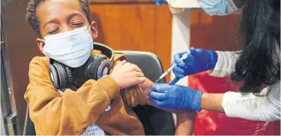  ?? SETH WENIG THE ASSOCIATED PRESS
FILE PHOTO ?? A nine-year-old receives the COVID-19 vaccine in Englewood, N.J., on Nov. 8. A parent has the essential duty to protect children from an uncertain world, and the vaccine will help, Bruce Arthur writes.