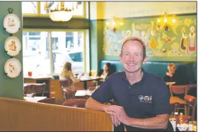  ?? (AP/Charles Rex Arbogast) ?? Chicago Alderman Tom Tunney poses inside his main Ann Sather restaurant Tuesday in Chicago. Social distancing requiremen­ts have curtailed revenue and the PPP loan Tunney got was quickly spent paying staff at the restaurant­s that are neighborho­od breakfast and brunch stalwarts. “My community and my business are everything, pretty much my family,” Tunney says.