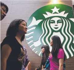  ?? Picture: BRENT LEWIN ?? COFFEE PICK-UP: Starbucks in China.