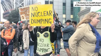  ??  ?? > Protesters in Cardiff ahead of the court hearing yesterday