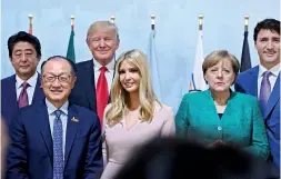  ??  ?? (L-R) Japan's Prime Minister Shinzo Abe, World Bank Group President Jim Yong Kim, US President Donald Trump, the daughter of the US President Ivanka Trump, German Chancellor Angela Merkel and Canada's Prime Minister Justin Trudeau attend the “Women's...