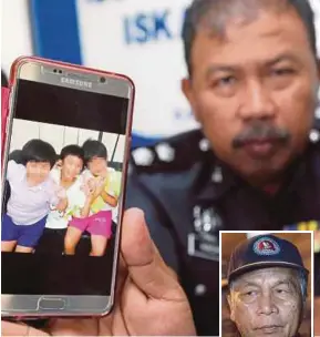  ??  ?? A policeman showing an image of teenagers who had run way from home. (Inset) Datuk Masir Kujat FILE PIX