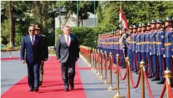  ?? — AFP ?? CAIRO: Jordan’s King Abdullah II reviews the honor guard alongside Egyptian President Abdel Fattah El-Sisi during a meeting in Cairo.