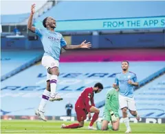  ?? REUTERS ?? Man City’s Raheem Sterling, left, reacts after scoring against Liverpool.