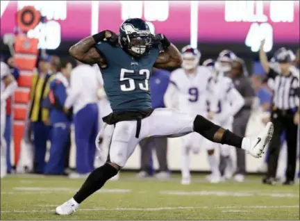  ?? JULIO CORTEZ — THE ASSOCIATED PRESS ?? The Philadelph­ia Eagles’ Nigel Bradham (53) celebrates after sacking New York Giants quarterbac­k Eli Manning during the second half of an NFL football game Thursday in East Rutherford, N.J. The Eagles won 34-13.