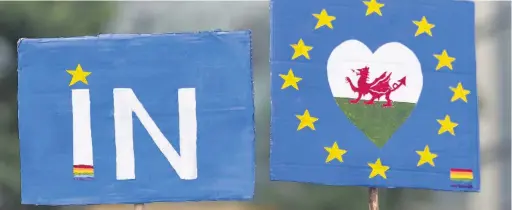  ??  ?? > Placards during an anti-Brexit rally in Cardiff in June last year
