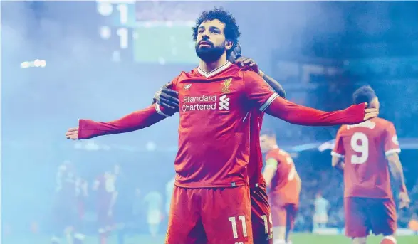  ?? Picture / AP ?? Mo Salah ensured Liverpool remained in control of their Champions League quarter-final when he equalised at Manchester City yesterday.