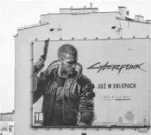  ?? PETER PAWLOWSKI • REUTERS ?? A billboard in Gdynia, Poland displays an advertisem­ent for the Cyberpunk 2077 video game by CD Projekt.