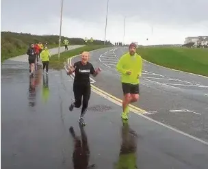  ??  ?? Cornelly Striders star Georgina Fraser and husband Gav who was a Porthcawl Parkrun first-timer