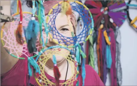  ??  ?? BEAUTIFUL CREATIONS
Jayne Terry with some of her handmade dream catchers at her home in Gosport