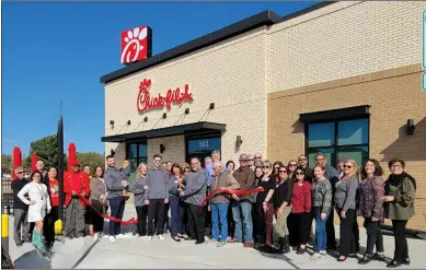 ?? (COURTESY PHOTO/BIG SPRING AREA CHAMBER OF COMMERCE) ?? Chick-fil-a celebrated the newest location, in Big Spring, with a special ribbon cutting ceremony on Nov. 29. The Big Spring Area Chamber of Commerce was on hand to help with the celebratio­n.