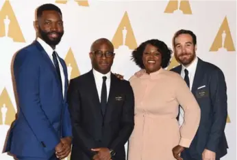  ?? KEVIN WINTER/GETTY IMAGES ?? Screenwrit­er Tarell Alvin McCraney, Moonlight director Barry Jenkins and editors Joi McMillon and Nat Sanders.