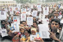  ??  ?? TRAGEDY Relatives of those trapped in the rubble at Rana Plaza