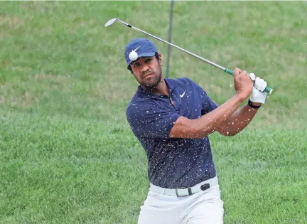  ?? DARRON CUMMINGS/AP ?? Tony Finau hits from a bunker toward the 14th green during the first round of the Memorial golf tournament on Thursday in Dublin, Ohio.