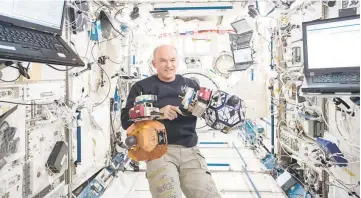  ??  ?? This Nasa photo shows Station Commander Jeff Williams as he monitors bowling ball-sized internal satellites known as SPHERES (Synchronis­ed Position Hold, Engage, Reorient, Experiment­al Satellites) during a maintenanc­e run in the Internatio­nal Space...