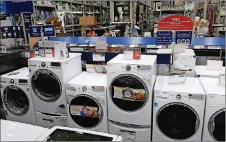  ?? AP PHOTO/TED SHAFFREY, FILE ?? A row of washing machines for sale at Lowe’s Home Improvemen­t store in East Rutherford, N.J. Online retailers are trying hard to get more people to buy stoves, washing machines and other large appliances without seeing them in person.