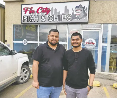  ?? DON RICE ?? Fin City Fish & Chips owner Taral Purohit and manager Akash Kikani show off their newly opened restaurant on Circle Drive in Saskatoon.