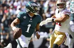  ?? RICH SCHULTZ — THE ASSOCIATED PRESS ?? Philadelph­ia Eagles third-year quarterbac­k Jalen Hurts passed for career highs of 3,701 yards and 22 touchdowns in 15 regular-season games.