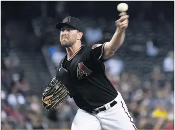  ?? MATT YORK — THE ASSOCIATED PRESS ?? Former USC standout Tyler Gilbert of the Diamondbac­ks threw a no-hitter on Saturday against San Diego in his first MLB start.