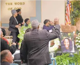  ?? KARL MERTON FERRON/BALTIMORE SUN ?? Mourners attend Helping Hands Ministries in Churchvill­e for Friday night’s memorial service to remember Jacquelyn Smith (pictured), the Harford County woman who was killed last week during an attack after she gave money to a panhandler in Baltimore.