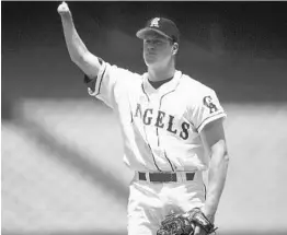  ?? JED JACOBSOHN/GETTY IMAGES FILE ?? Jim Abbott takes the mound for the California Angels in 1996. Abbott, who was born without a right hand, won 87 games and pitched a no-hitter in 10 major-league seasons.