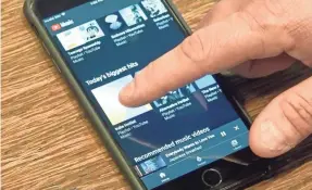  ?? JEFFERSON GRAHAM/USA TODAY ?? YouTube Music Premium has the best selection, but the $2-a-month charge for background listening is unfair to YouTube fans.