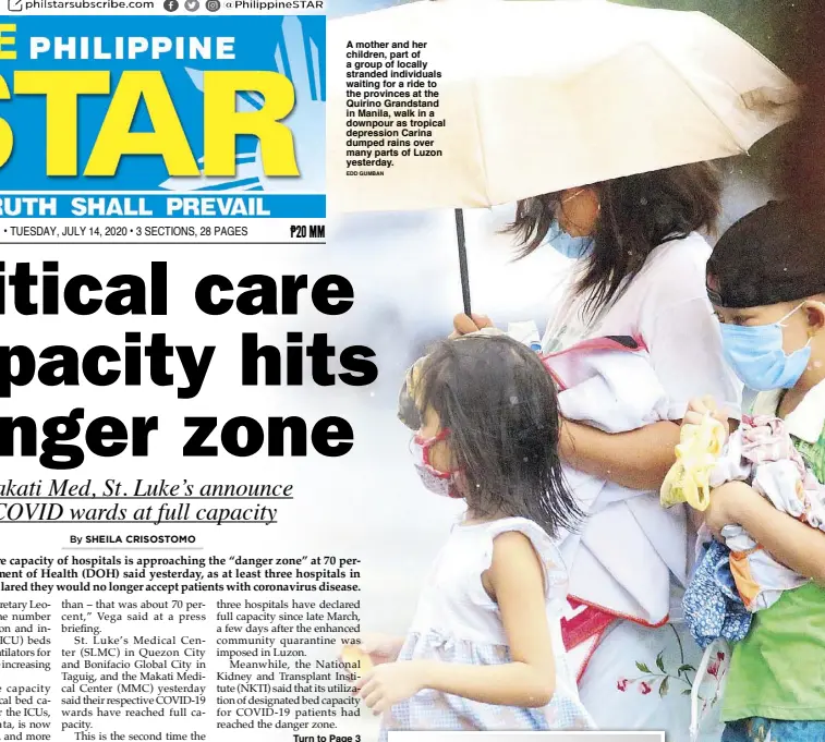  ?? EDD GUMBAN ?? A mother and her children, part of a group of locally stranded individual­s waiting for a ride to the provinces at the Quirino Grandstand in Manila, walk in a downpour as tropical depression Carina dumped rains over many parts of Luzon yesterday.