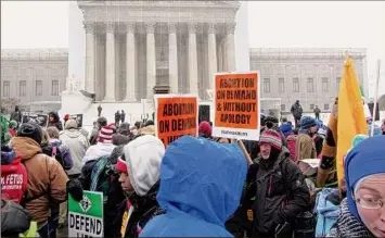  ?? Coast-to-coast / Getty Images ?? Protesters in front of the Supreme Court in 2013.