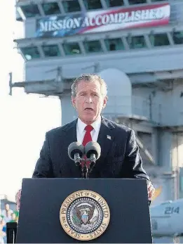  ?? GETTY IMAGES ?? After Saddam’s regime fell, President George W. Bush declared — in an infamous photo op — an end to major combat operations in Iraq. Most American combat deaths came after that moment aboard the carrier Abraham Lincoln in May 2003.