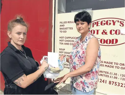  ?? Peggy’s Hot & Cold Food in Arbroath is collecting money for an old lady who had her pension snatched. Manager Sharon Thomson accepts a donation from Emma Neave. Picture: Gareth Jennings. ??