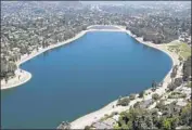  ?? Don Kelsen Los Angeles Times ?? THE LAKE in 2013. It is no longer used for drinking water, after a federal crackdown on open-air storage.