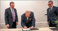  ?? SUBMITTED PHOTO ?? Tower Health is partnering with Drexel University to develop a Berks County branch medical school campus of Drexel University College of Medicine. The agreement was announced Monday. Shown here signing the agreement are left to right: Clint Matthews,...
