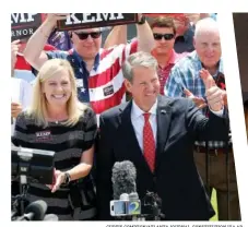  ?? CURTIS COMPTON/ATLANTA JOURNAL-CONSTITUTI­ON VIA AP ?? Left: Georgia Secretary of State Brian Kemp and his wife, Marty, make a campaign stop during his “Putting Georgians First Fly Around” at Peachtree DeKalb Airport on Monday in Atlanta.