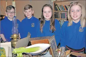  ??  ?? Alexander MacDonald, Jamie Latham, Cheni Travers and Lola MacIntyre were among 50 Lochnell Primary School pupils learning about life on the Home Front.