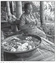  ??  ?? At Bambu Indah hotel, a Balinese woman comes each day to make offerings of flowers and woven bamboo to the spirits that are an integral part of daily life on Bali.
