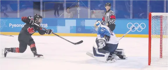  ?? BRUCE BENNETT/GETTY IMAGES ?? Halifax’s Jillian Saulnier scores for Canada against Noora Raty of Finland on Tuesday in Gangneung, South Korea. Canada won 4-1.