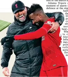  ?? ?? HE ALWAYS DELIVERS:
Klopp hugs
Origi after his late goal sealed a fourth straight league win